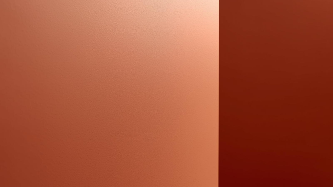 Dettaglio ravvicinato di una parete con finitura liscia opaca color argilla, novità colori pareti 2026
